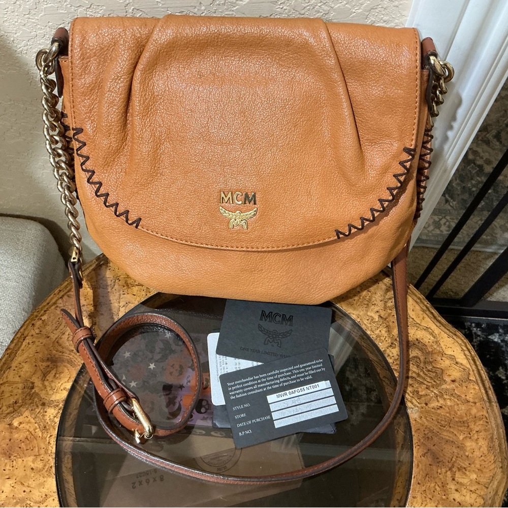 MCM shoulder bag in a tan or cognac featuring gathered flap and whipstitch trim - Picture 2 of 9